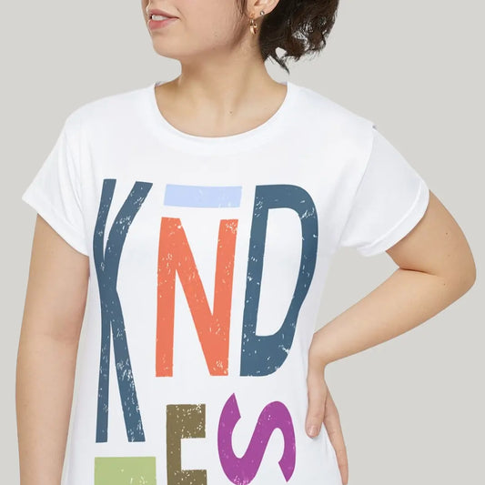 Woman wearing white Be Kind T-shirt with large multicolor stacked KINDNESS typography