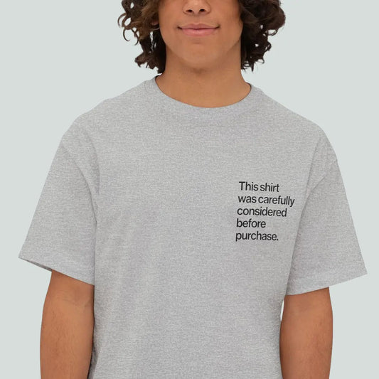 Grey minimalist Helvetica tee with small left-chest text for introverts and overthinkers