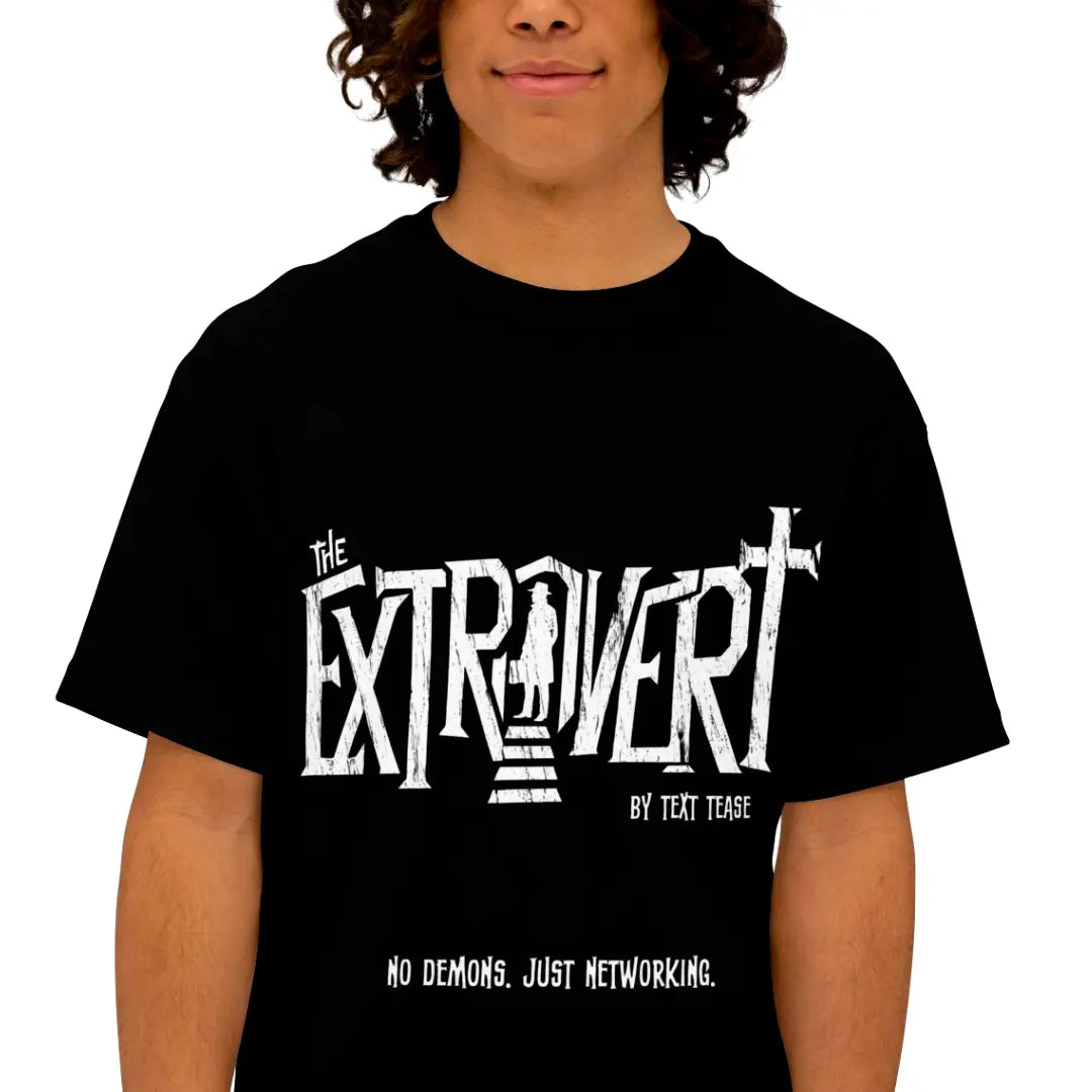 Man wearing the Extrovert horror parody introvert tee with distressed white typography and doorway silhouette