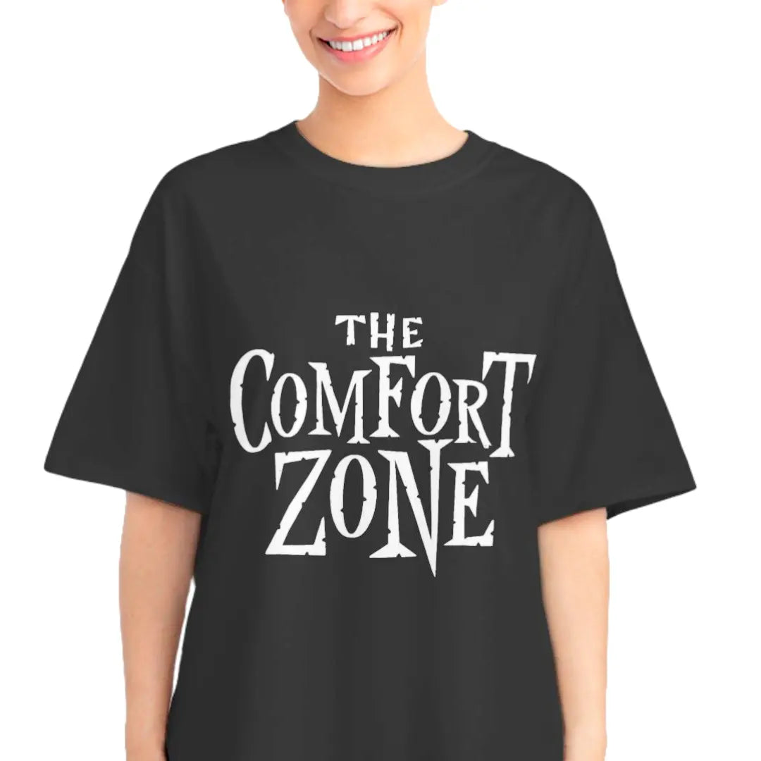 Smiling woman wearing the black The Comfort Zone retro sci-fi parody T-shirt with jagged white typography