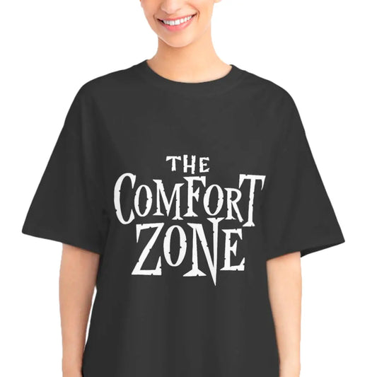 Smiling woman wearing the black The Comfort Zone retro sci-fi parody T-shirt with jagged white typography