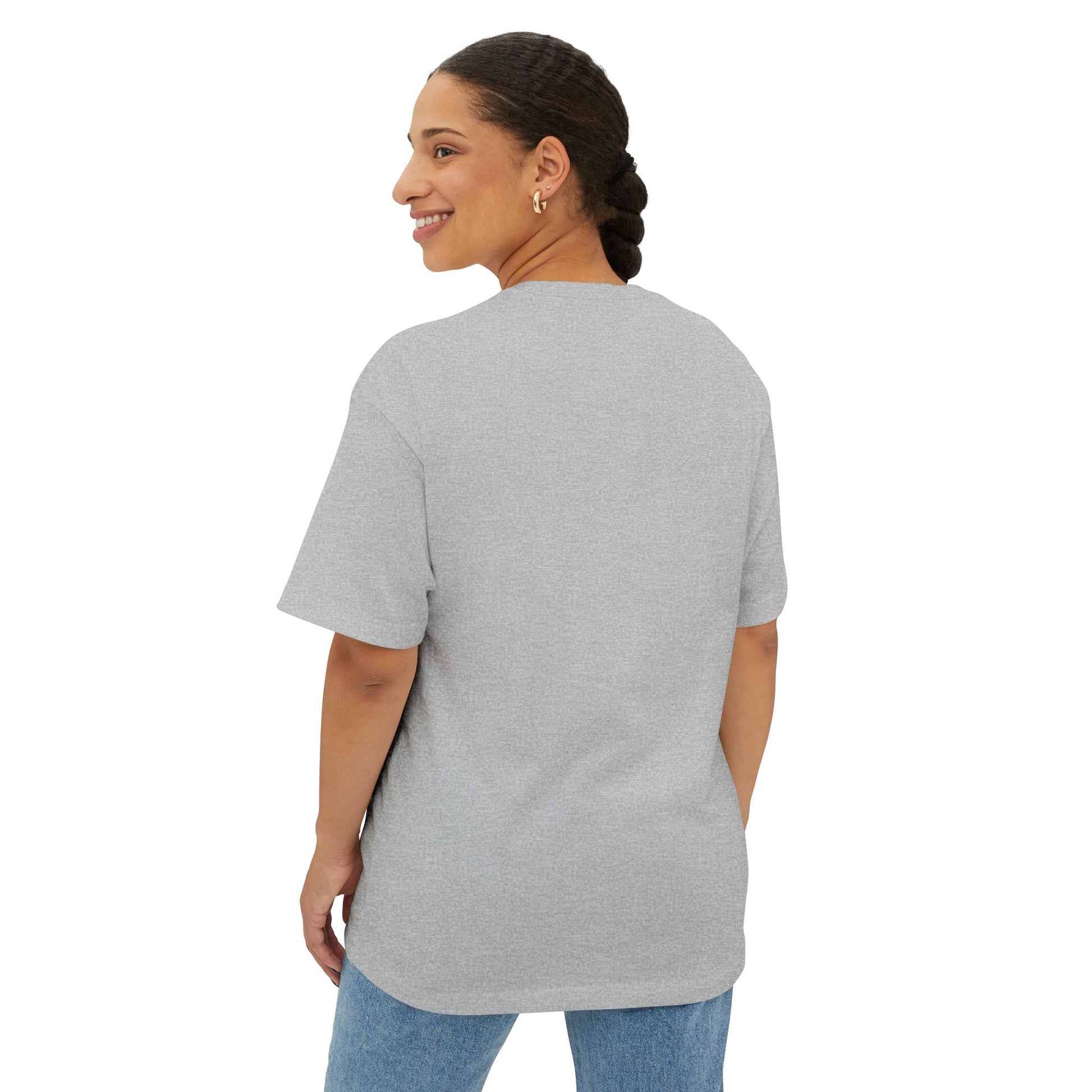 Woman wearing a gray t-shirt and blue jeans on a white background