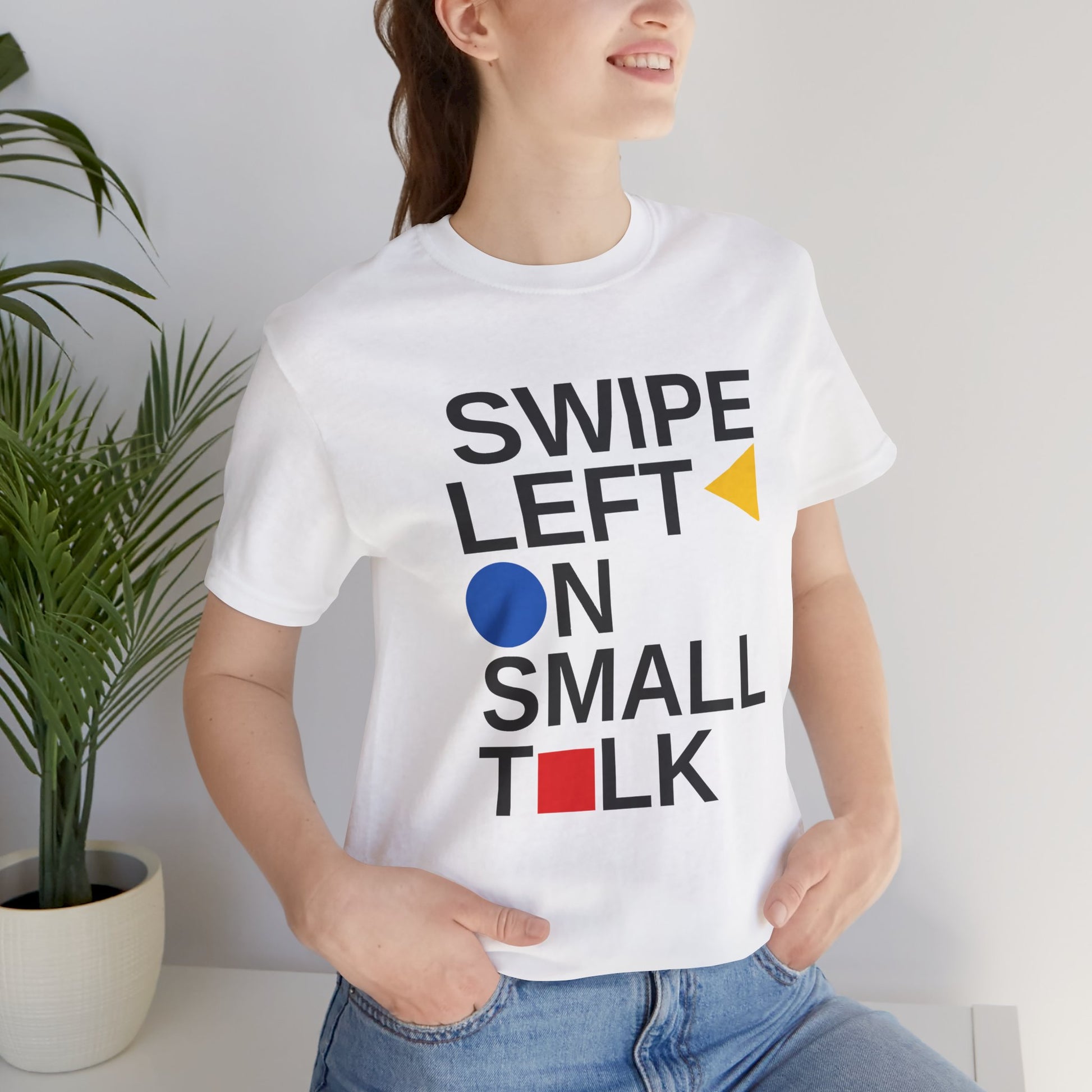 Person wearing a white t-shirt with 'Swipe Left on Small Talk' text design.