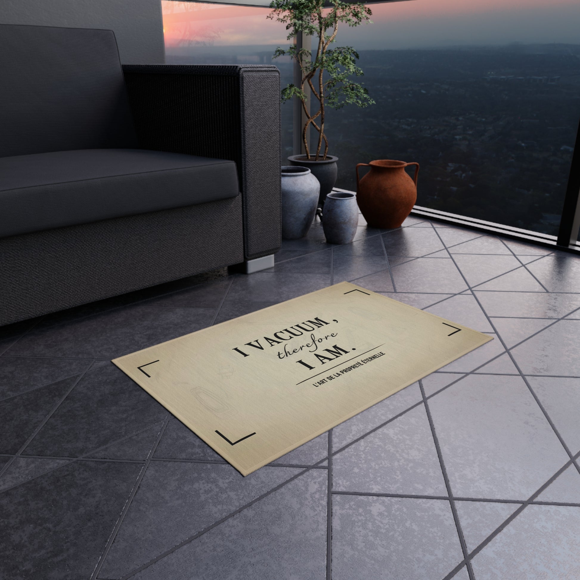 Funny quote rug on tiled balcony floor beside modern sofa and plants, minimalist home decor with subtle humor.