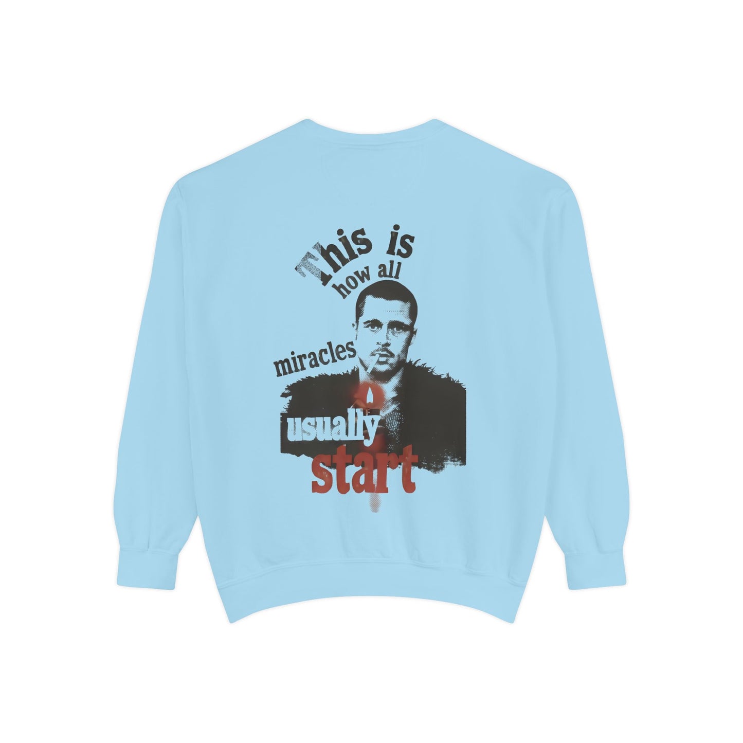 Light blue sweatshirt with brad pitt illustration and typography "this is how all miracles usually start"