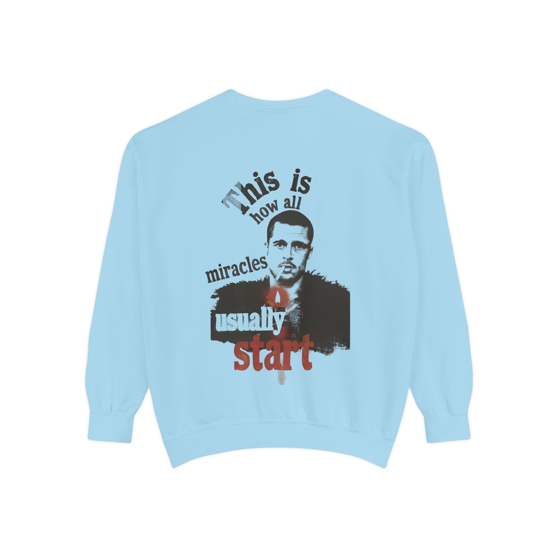 Light blue sweatshirt with brad pitt illustration and typography "this is how all miracles usually start"