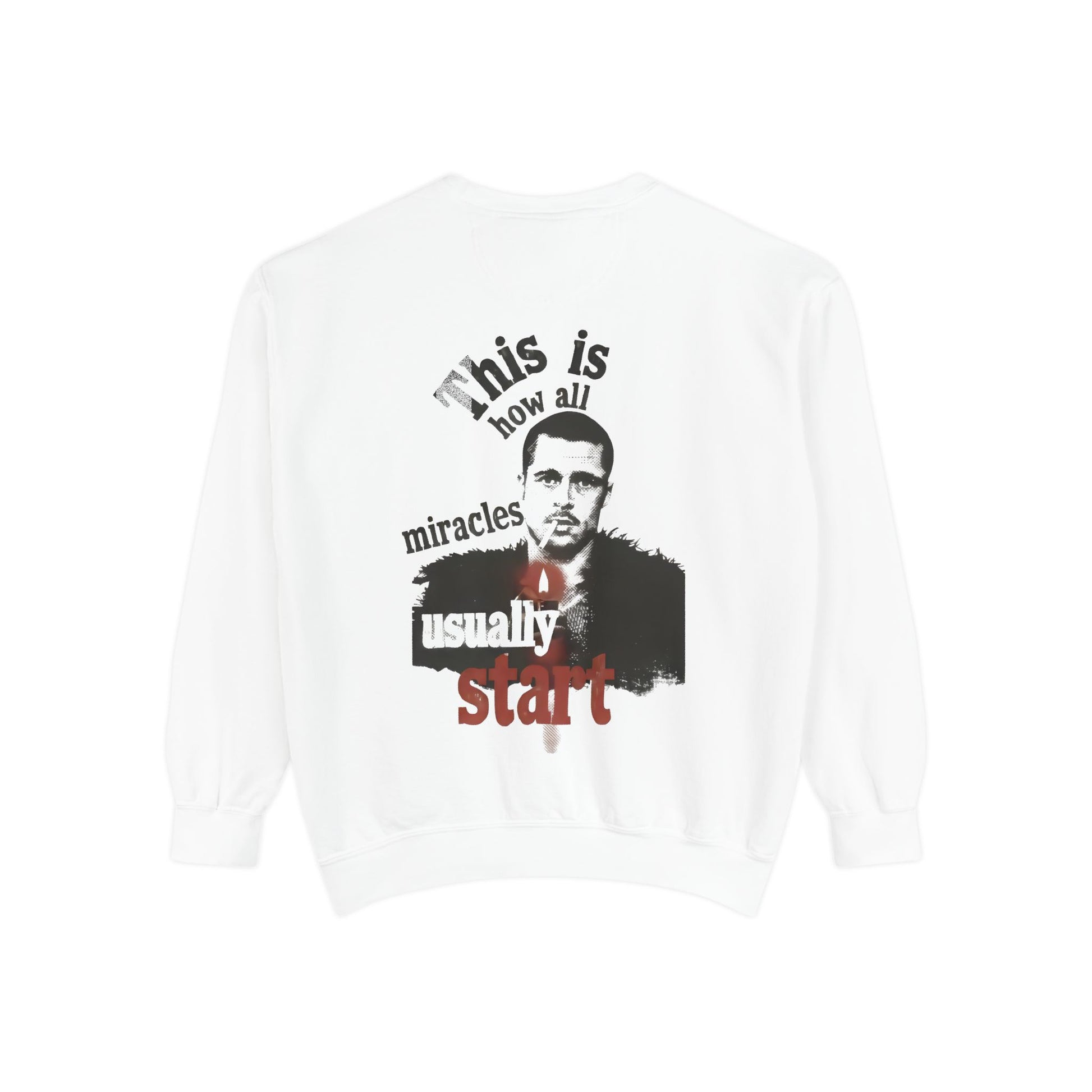 White sweatshirt with a graphic design featuring brad pitt illustration and typography "this is how all miracles usually start"