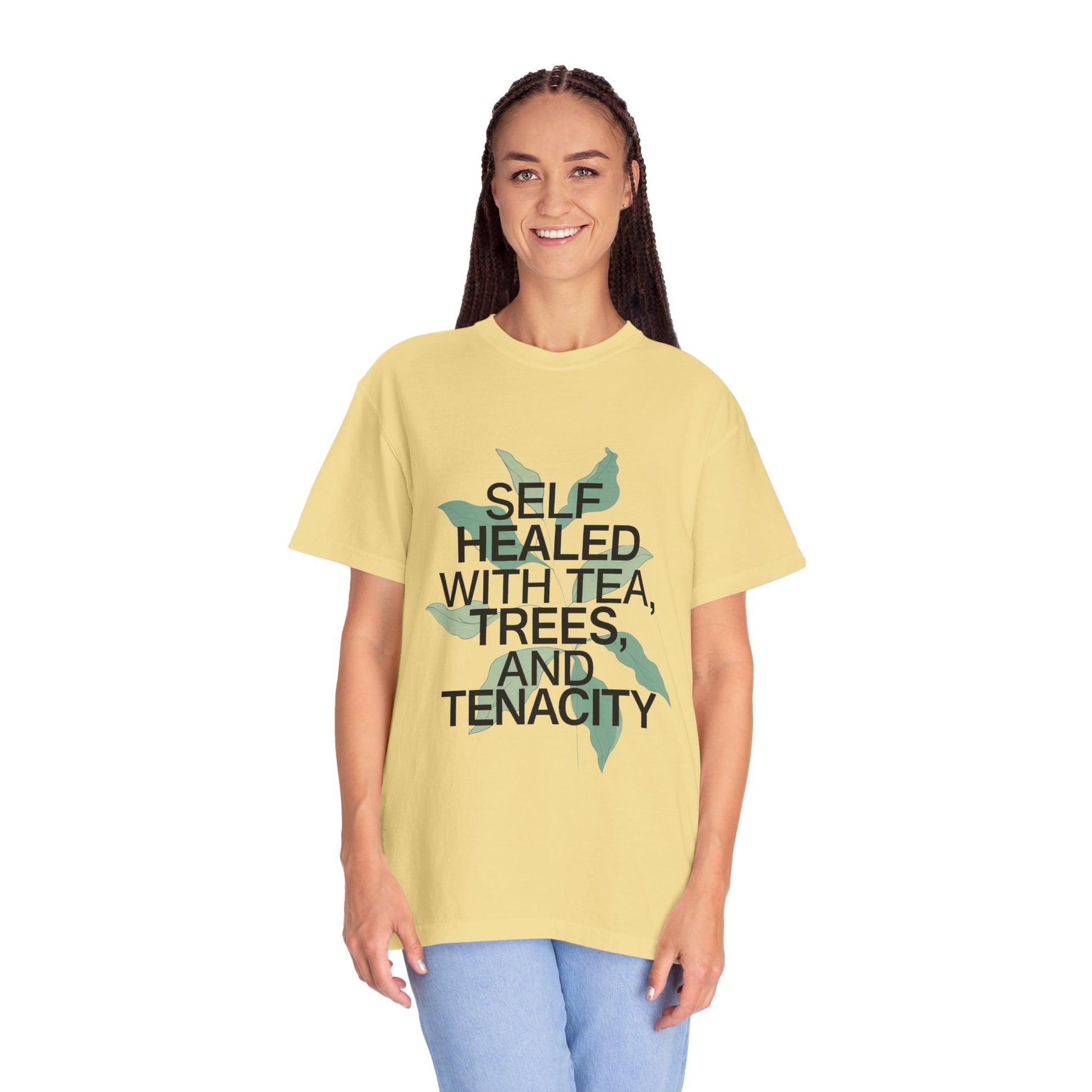Person wearing a yellow t-shirt with text and butterfly design on a white background