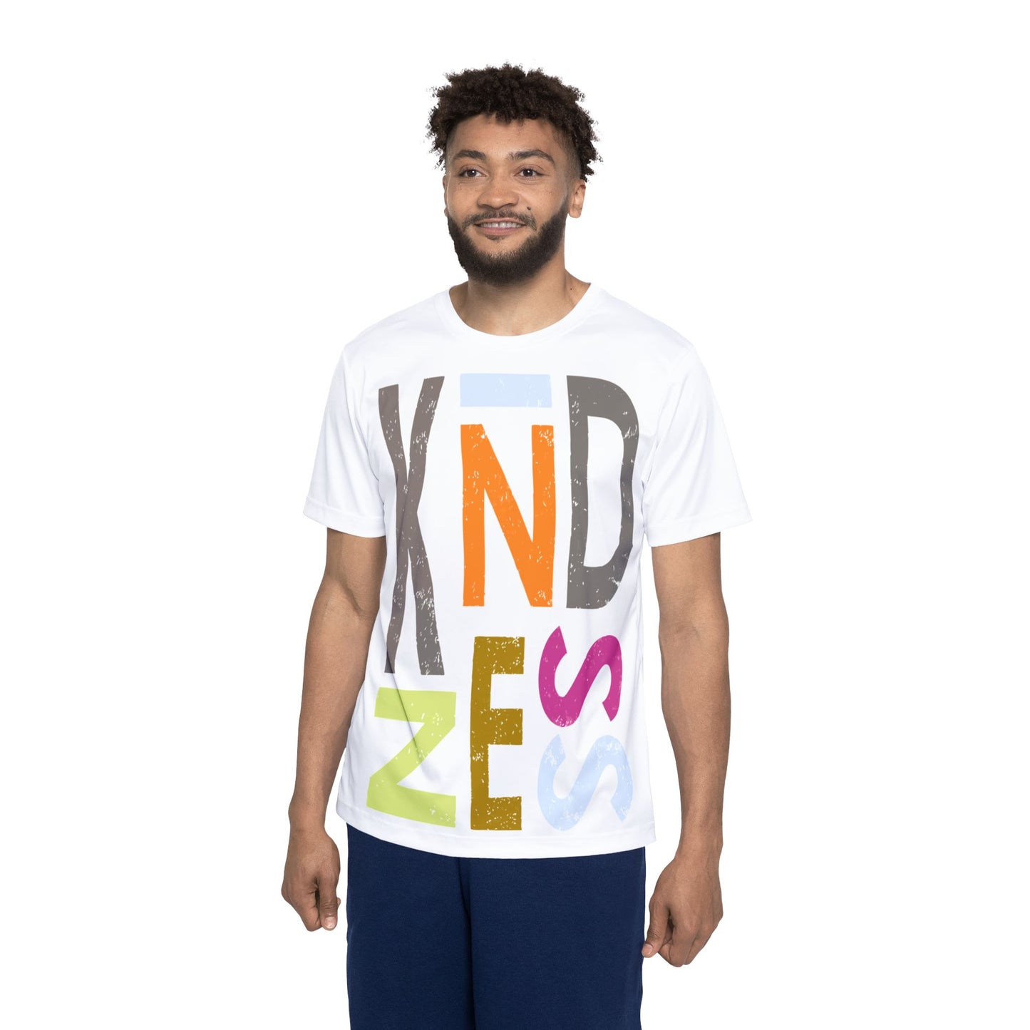 Man wearing a white t-shirt with colorful letters spelling 'Kindness' on a white background