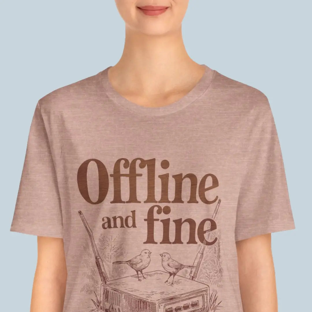 Person wearing a t-shirt with 'Offline and fine' design on a light blue background