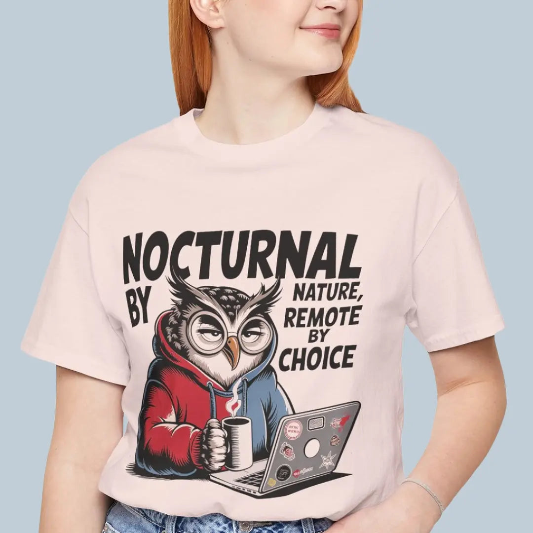Person wearing a t-shirt with an owl graphic and text 'Nocturnal by nature, remote by choice' on a light blue background.
