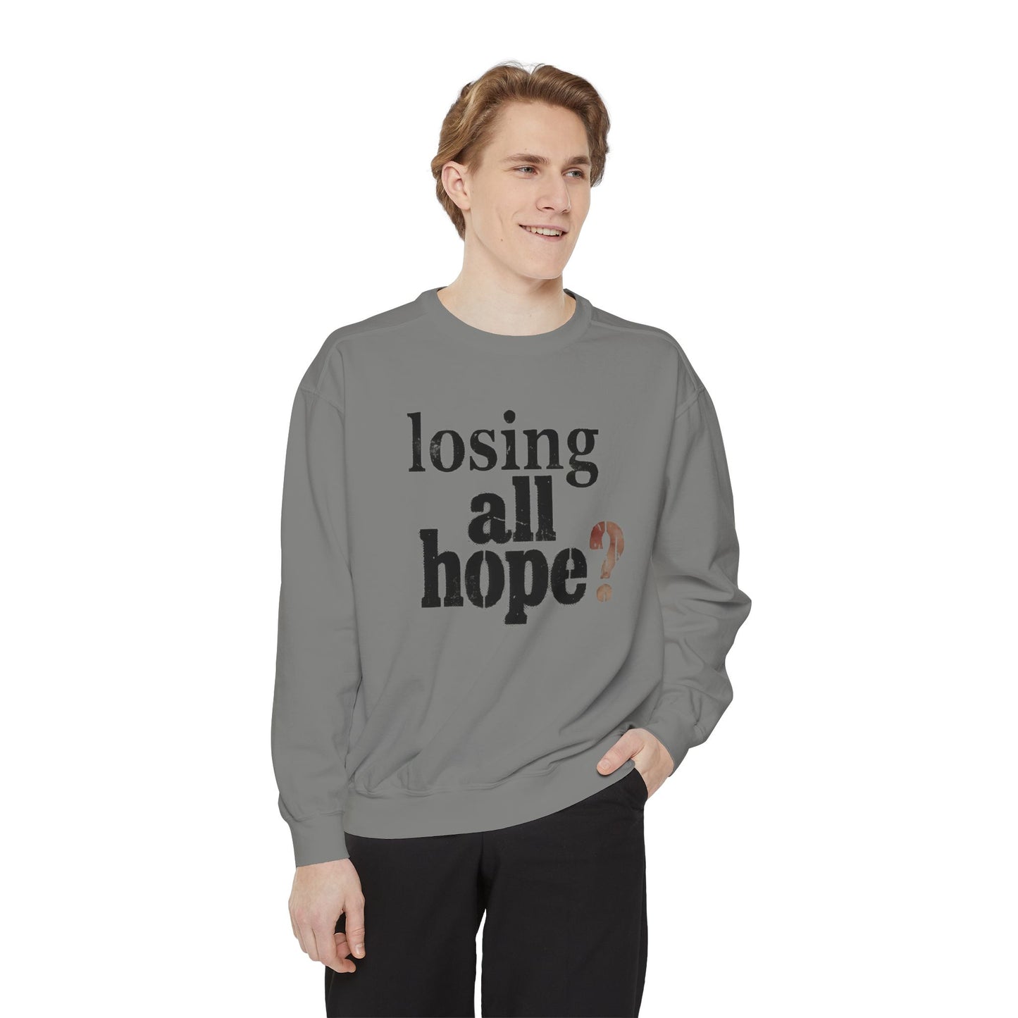 Person wearing a gray sweatshirt with text on a white background
