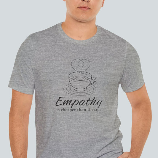 Person wearing a gray t-shirt with a coffee cup graphic and text on a light blue background