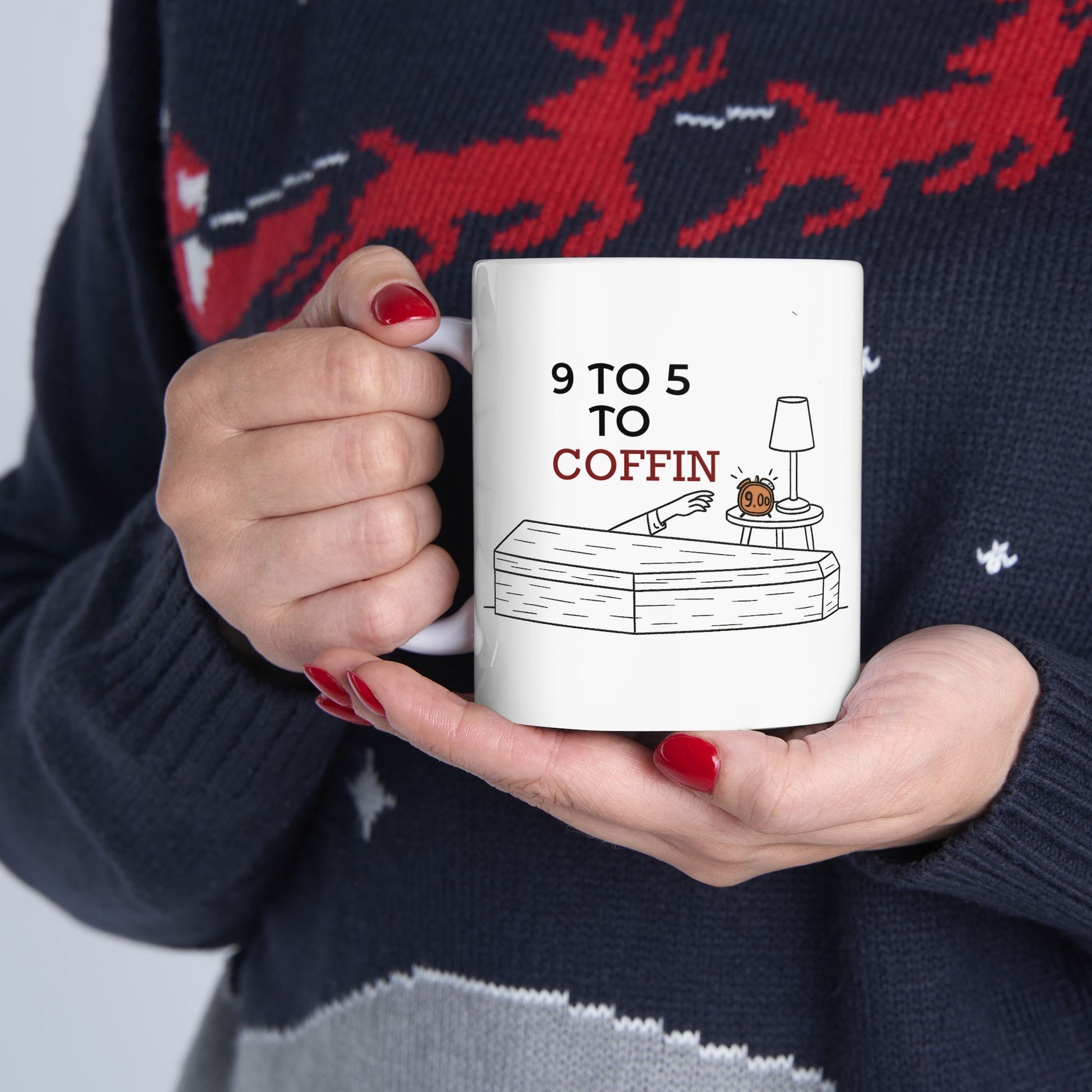 Person holding a Dead Inside mug with 9 TO 5 TO COFFIN typography and coffin illustration for burnout and job stress humor for introverts