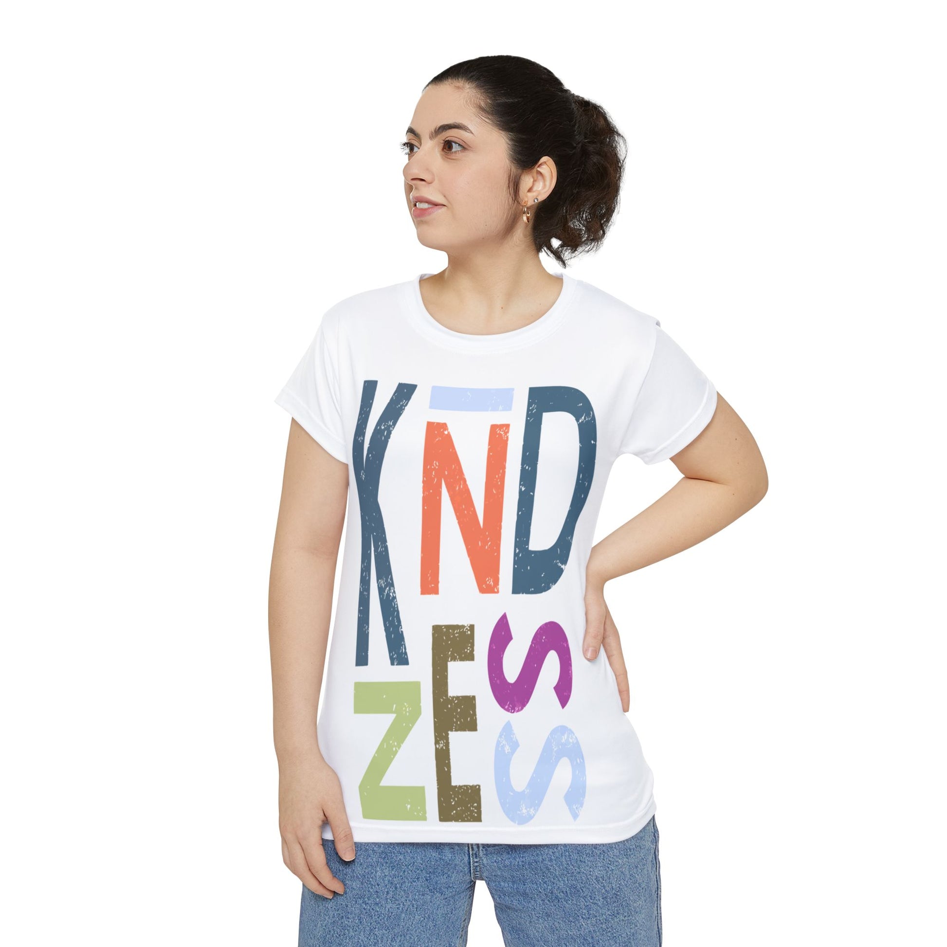 Woman wearing a white t-shirt with colorful letters spelling 'Kindness' on a white background