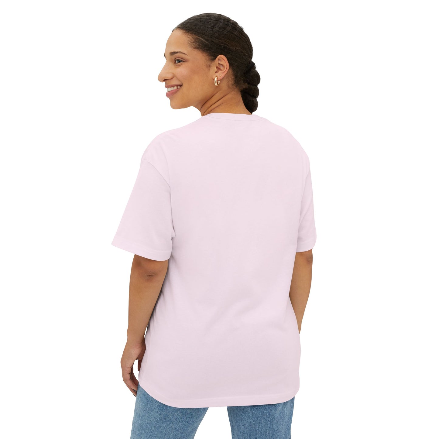 Woman wearing a light pink t-shirt and blue jeans on a white background