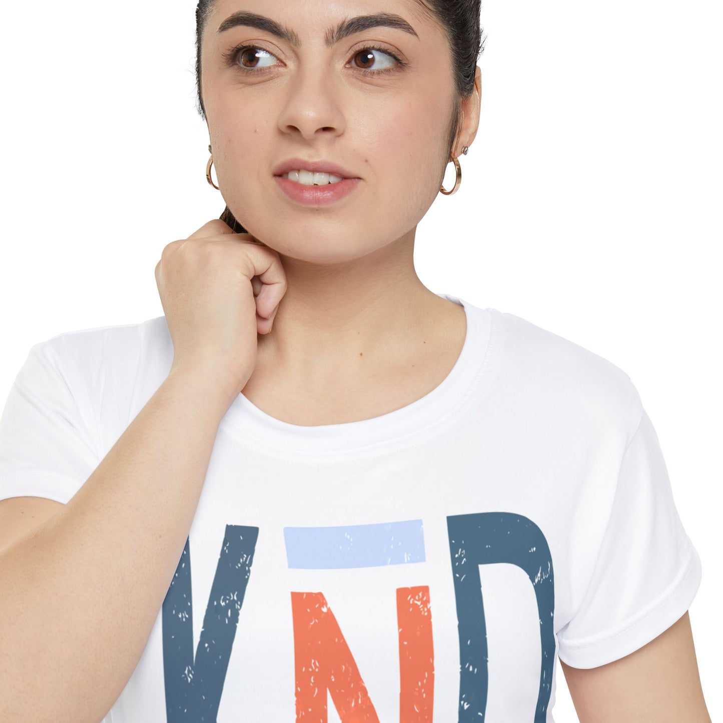 Woman wearing a white t-shirt with colorful letters on a plain background