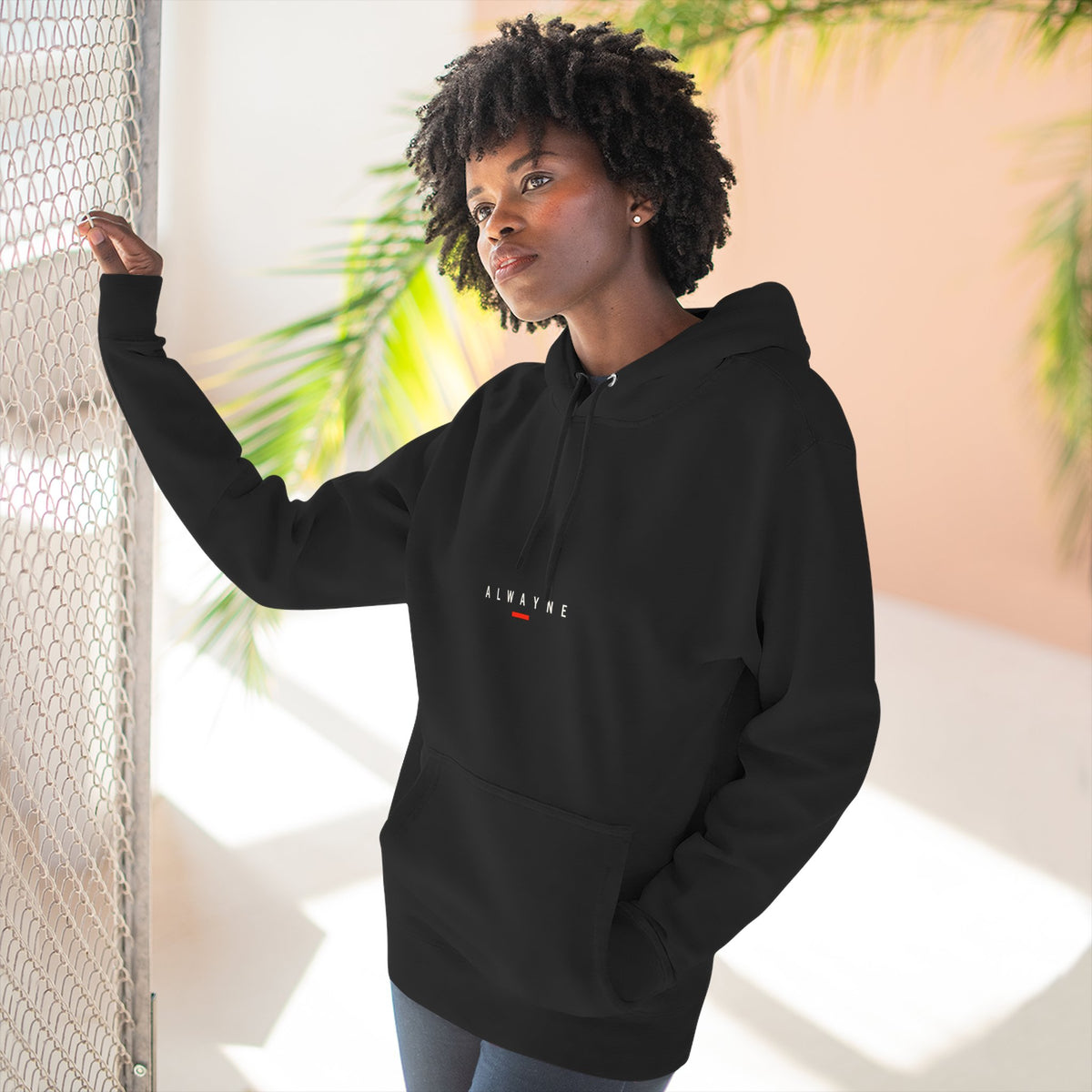 Alwayne Still Moving black three-panel fleece hoodie with front identifier and back graphic