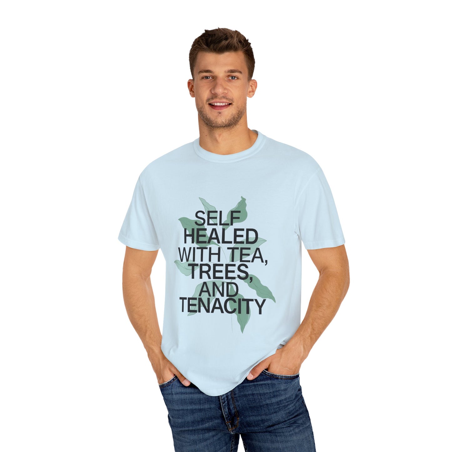 Man wearing a light blue t-shirt with text and a graphic design on a white background