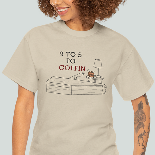 Person wearing a beige t-shirt with a graphic design and text '9 TO 5 TO COFFIN' on a light gray background