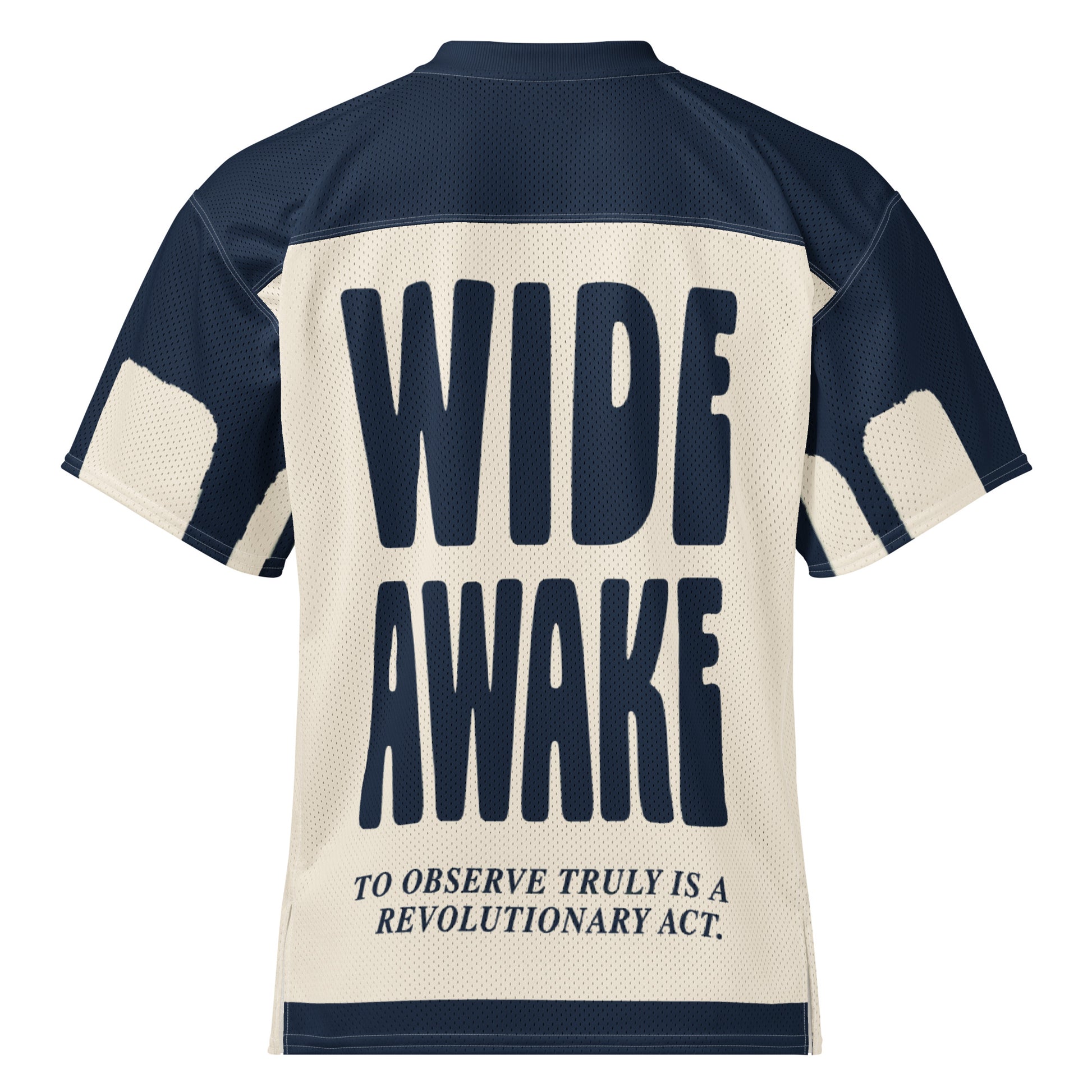 The back of an all-over-print conceptual streetwear jersey for Text Tease. Bold navy typography reads "WIDE AWAKE" and "To observe truly is a revolutionary act," emphasizing a minimalist yet authoritative aesthetic.