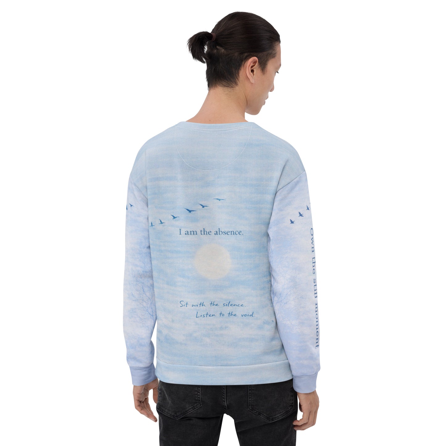 Back view of cloud print quote sweatshirt showing “I am the absence” text on a soft sky and cloud background