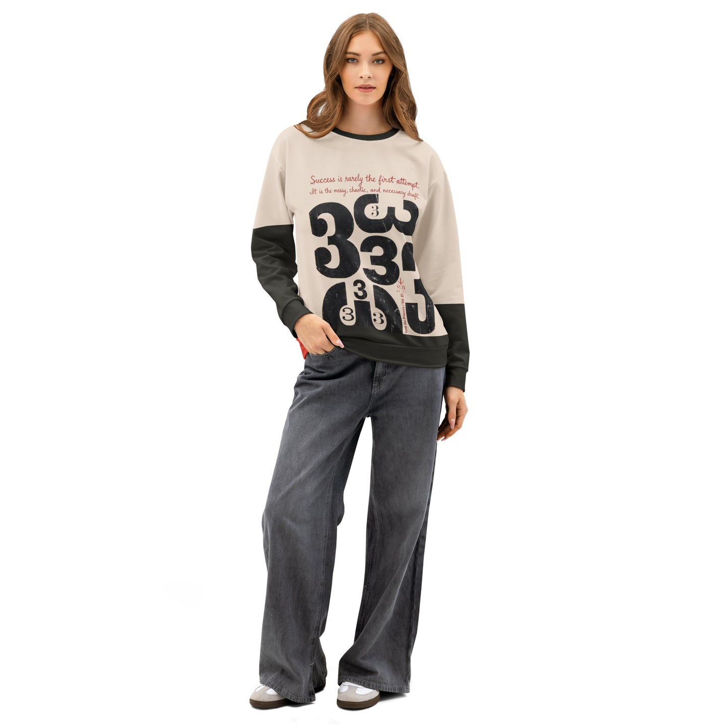 Female model wearing the Process Vol. 01 graphic crewneck, shown front facing in a relaxed stance with one hand in pocket, featuring distressed draft-style typography and layered “333” motif representing the messy internal creative process.