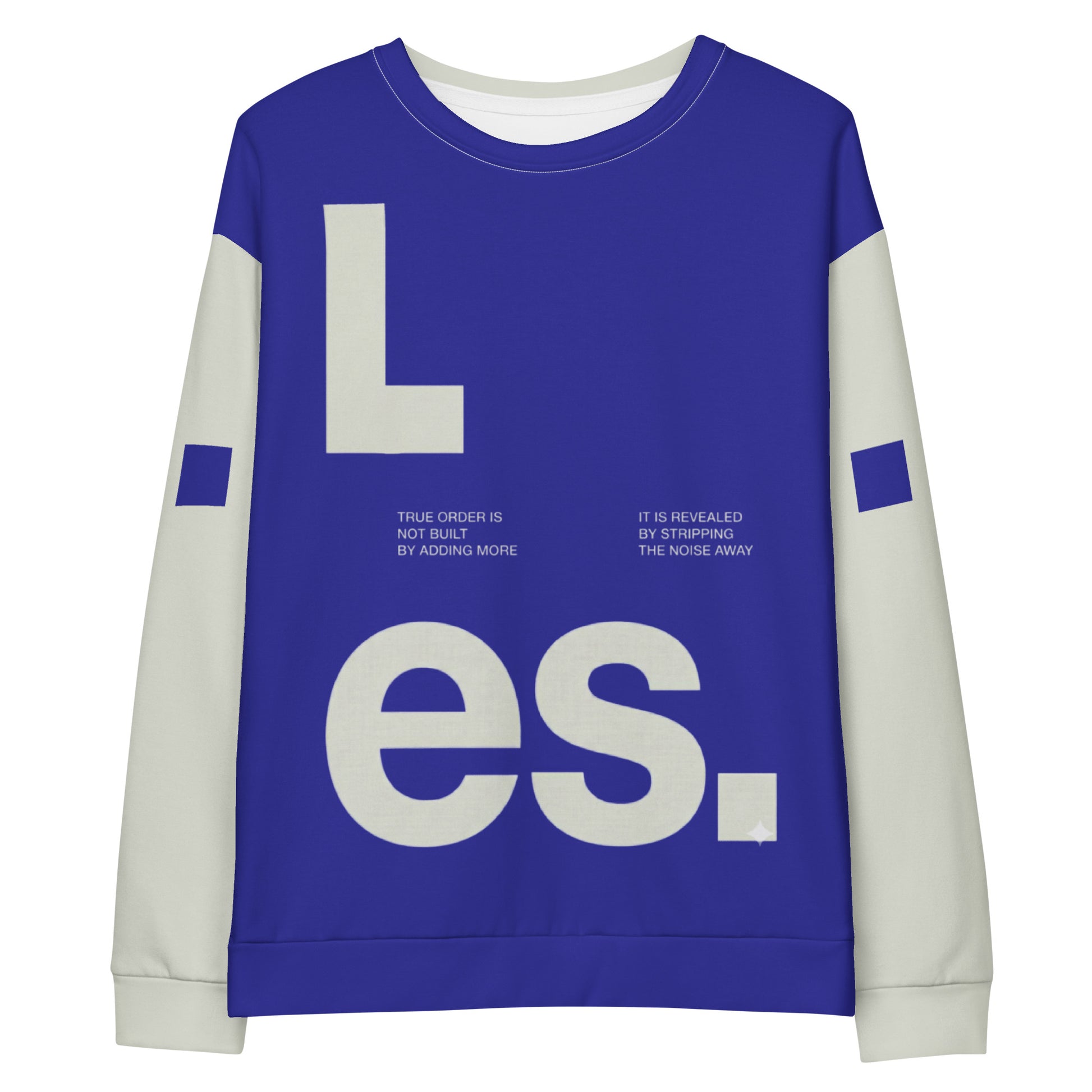 Studio flat lay of the Dialectic Crewneck's front, highlighting a deep blue rectangular panel set against a light cream-colored body. The design features bold, oversized ivory-white typography spelling "L.es." with smaller, justified manifesto text placed in the center: "TRUE ORDER IS NOT BUILT BY ADDING MORE" on the left and "IT IS REVEALED BY STRIPPING THE NOISE AWAY" on the right. Light cream sleeves are visible, featuring small, navy-blue geometric square accents.