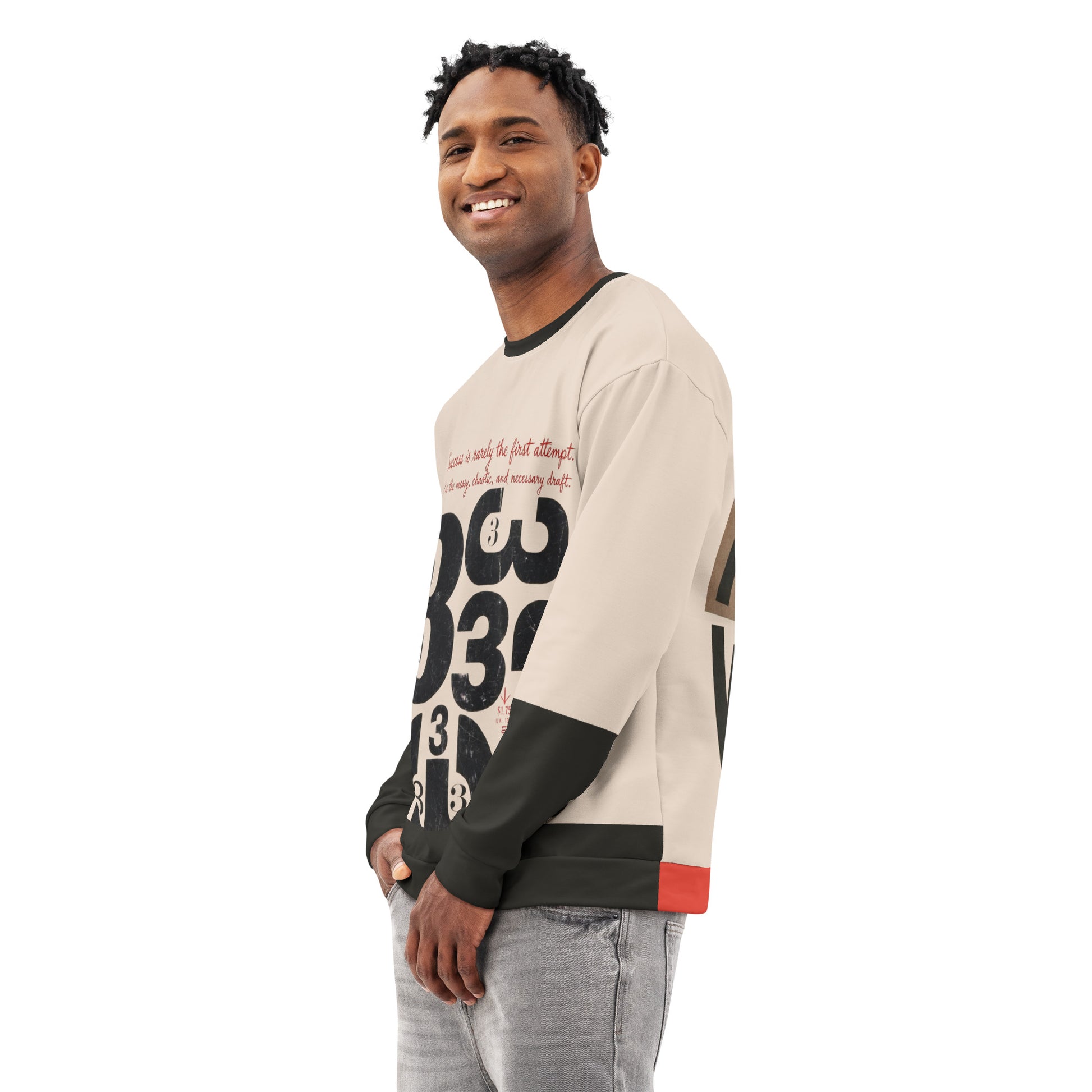 Model wearing a cream crewneck sweatshirt with black sleeves, shown in a three-quarter side pose, featuring distressed “333” draft-style typography on the front with a relaxed unisex fit.