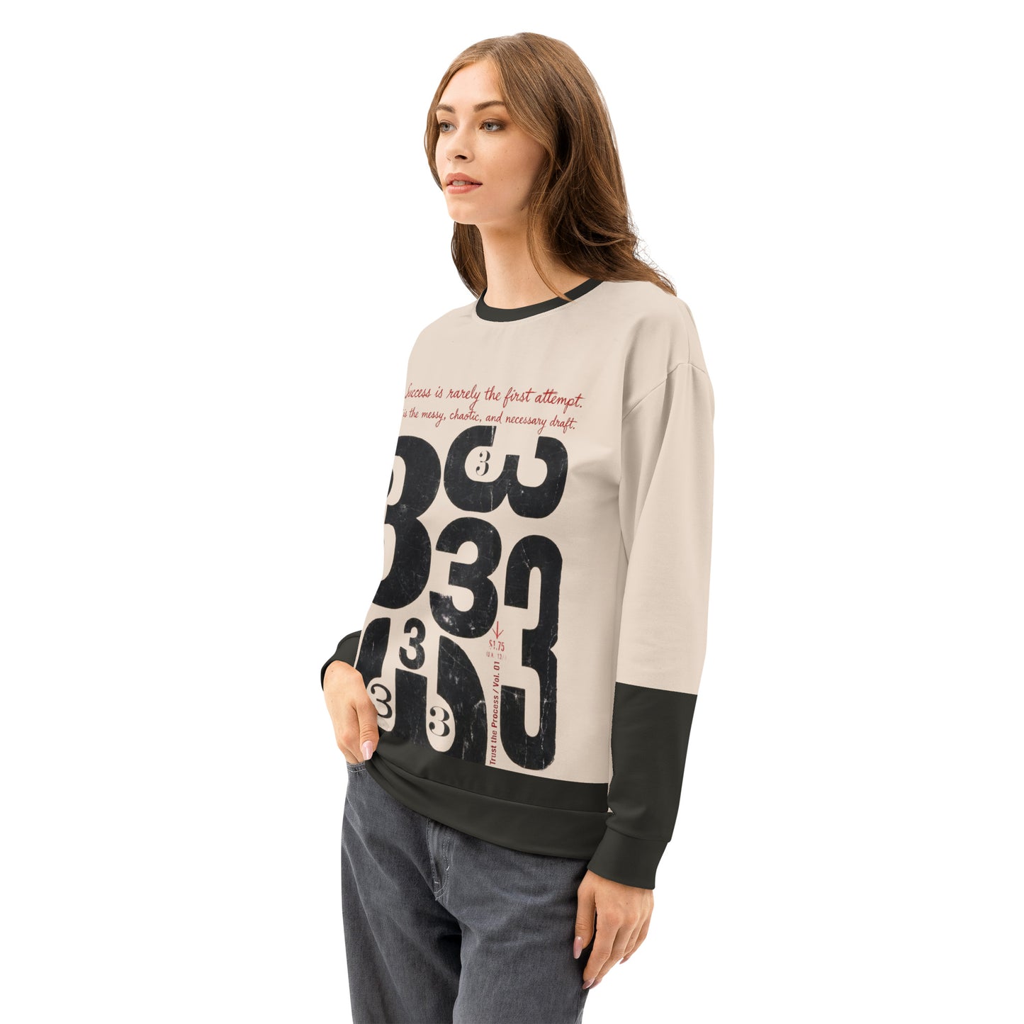 Female model wearing the Process Vol. 01 graphic crewneck, shown in a three-quarter side pose, featuring distressed draft typography and the layered “333” motif on the front, expressing the quiet, messy stage of the creative process.