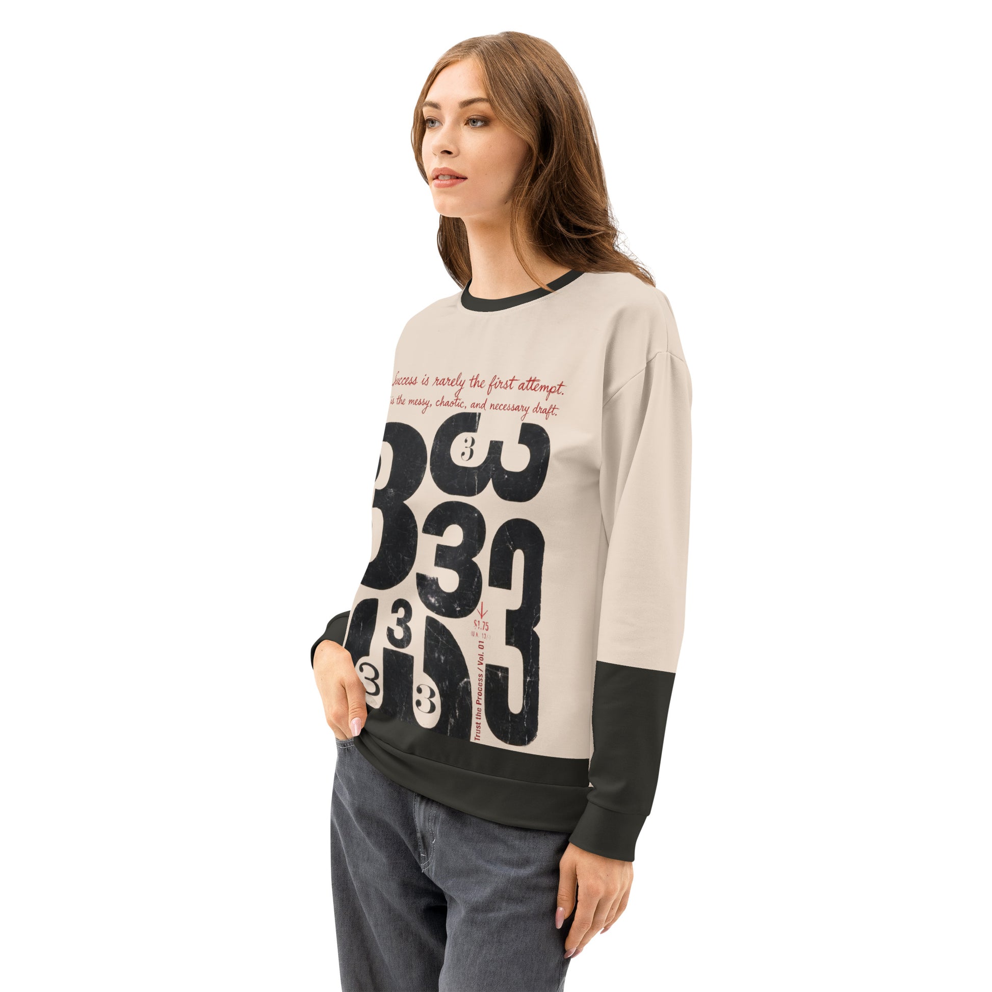 Female model wearing the Process Vol. 01 graphic crewneck, shown in a three-quarter side pose, featuring distressed draft typography and the layered “333” motif on the front, expressing the quiet, messy stage of the creative process.