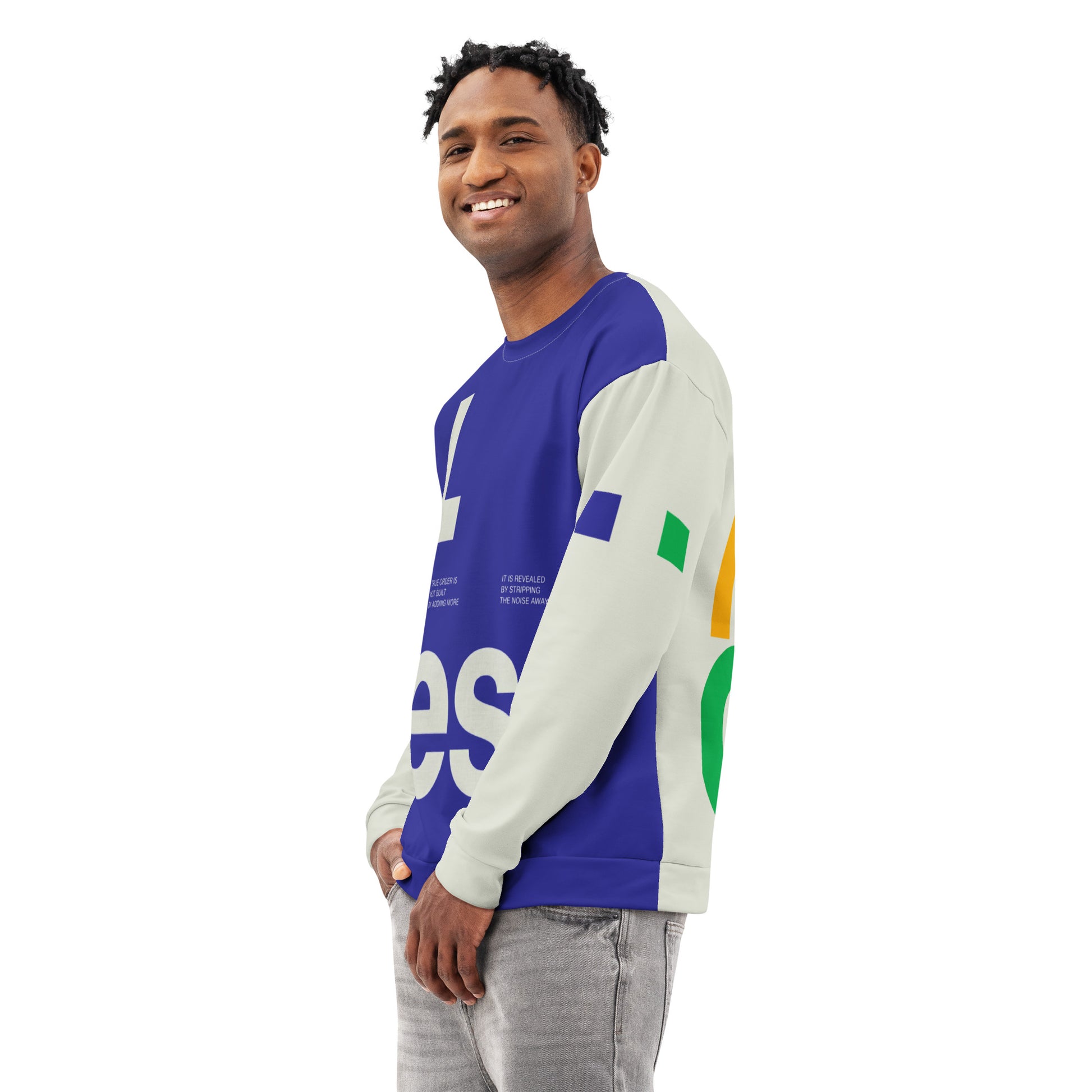 A three-quarter side view of a male model wearing the Dialectic Crewneck. The design showcases the sharp transition between the deep blue minimalist front panel with white typography and the cream-colored sleeve featuring a small green geometric square accent.
