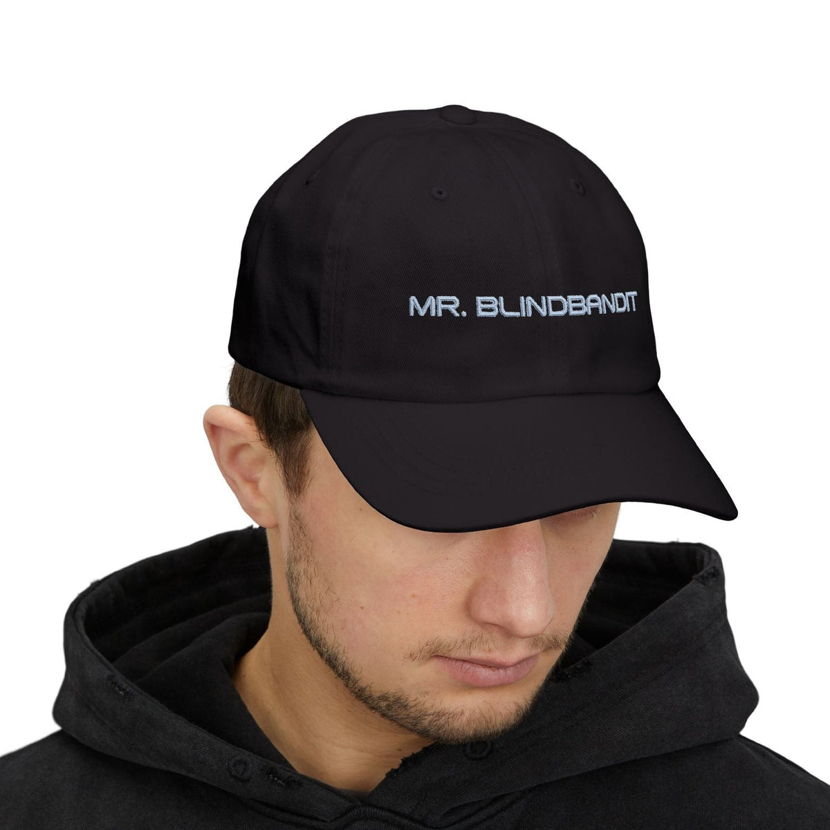 Mr. Blindbandit black adjustable cotton dad cap worn by a male model, front view with eyes hidden by the brim