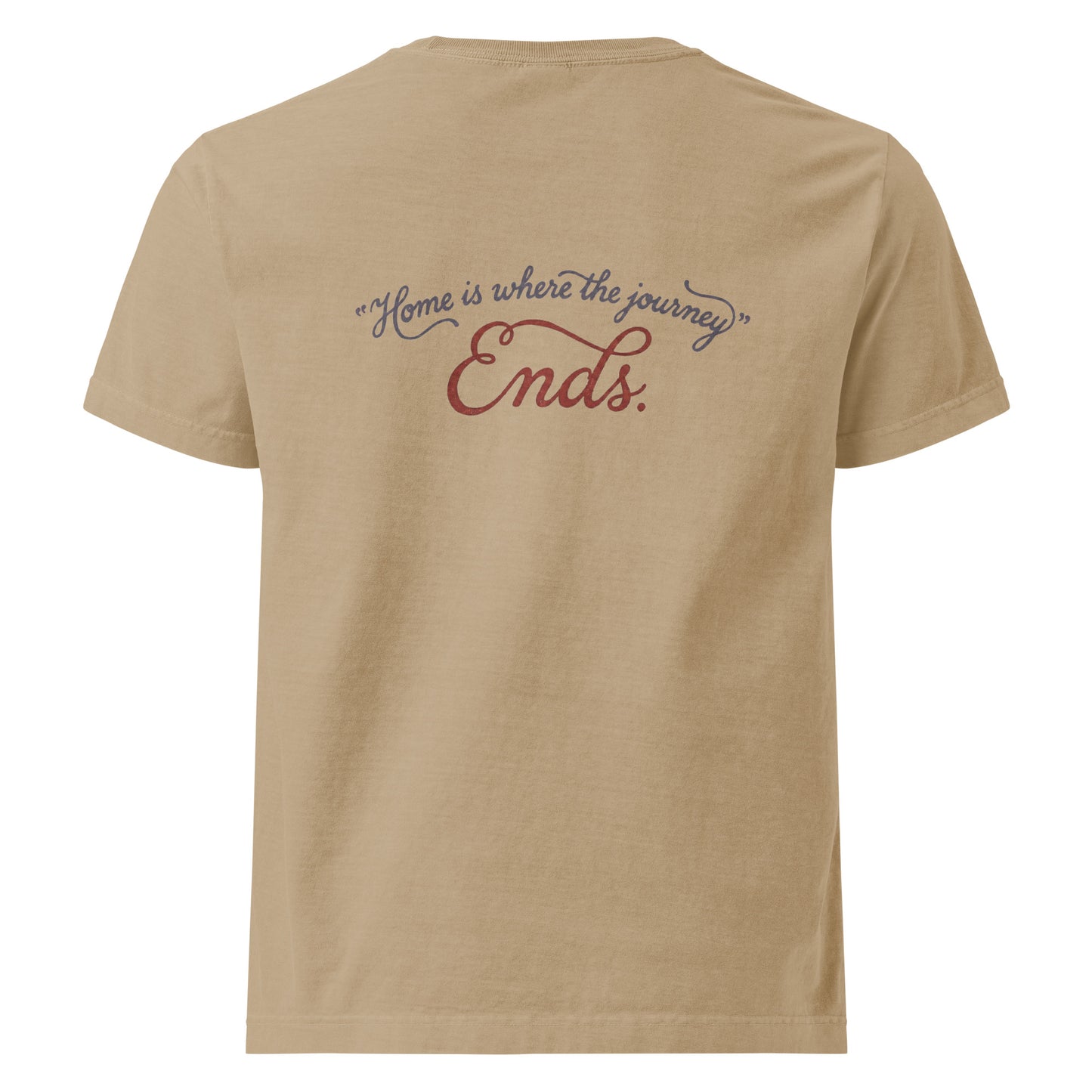 Flat back view of the beige heavyweight streetwear T-shirt showing a distressed script graphic reading “Home is where the journey ends,” on garment-dyed cotton with an oversized unisex cut.