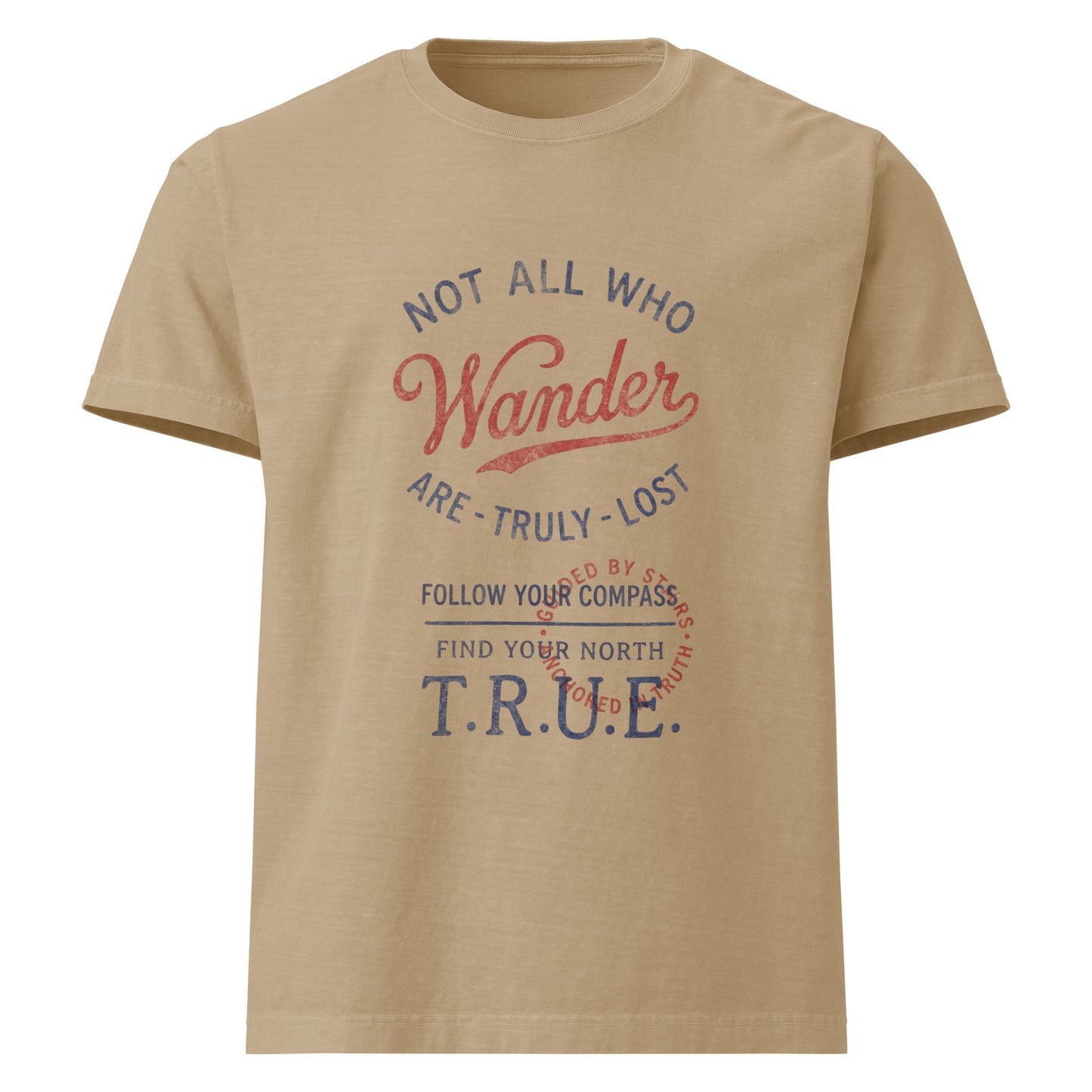 Flat front view of a beige heavyweight streetwear T-shirt with a distressed vintage compass graphic and the text “Not All Who Wander Are Truly Lost,” printed on garment-dyed cotton in an oversized unisex fit.
